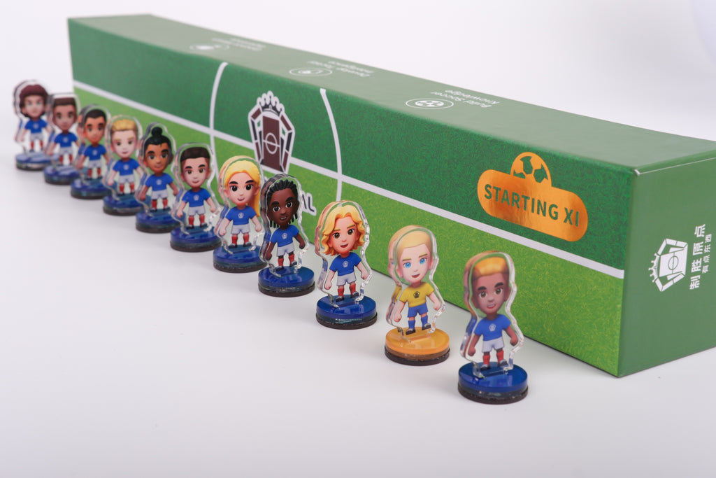 Origin Goal National Team Squad Mystery Box — a full Starting XI of acrylic football figures lined up beside the pitch-print collector box