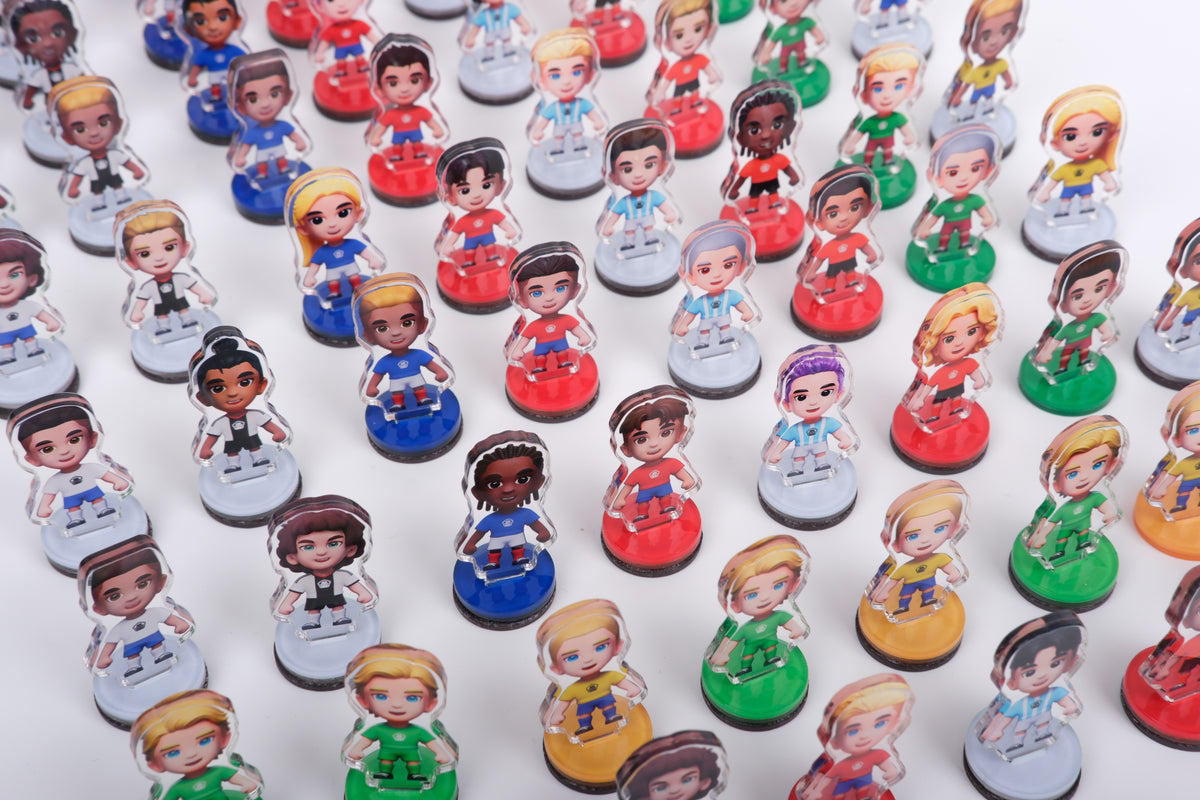 Close-up of Origin Goal collectible football figures in different national team kits